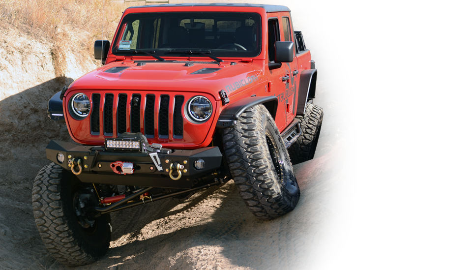 red MetalCloak Jeep JT Gladiator on banked dirt trail